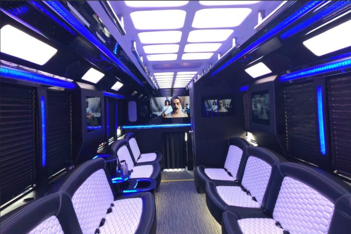 Party bus interior with wraparound seating